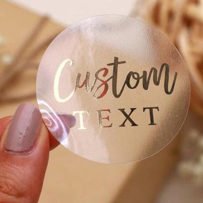 China Custom Size Waterproof Quality Gold Foil Printing Stickers Roll Vinyl Waterproof Logo Product Bottle Labels Clear Transparent Foil for sale