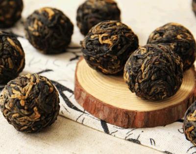 China Yunnan Dragon Pearls Tea Cheap Black Ball Natural Organic Black Tea In Bulk for sale