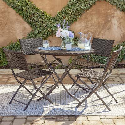 China Modern low price hot selling rattan dining set with cushions rattan table and chairs 5 piece set for sale