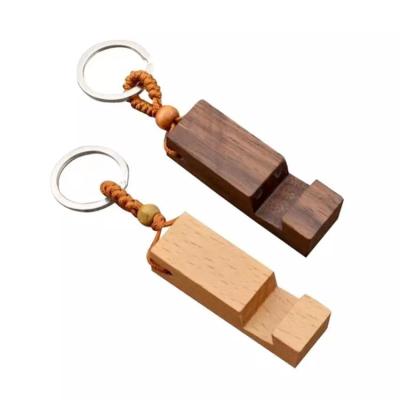 China Ring Cell Phone Stand Wooden Chain Best Gift Wooden Chain Ring Promotion Gift Phone Holder Rectangle Base for sale