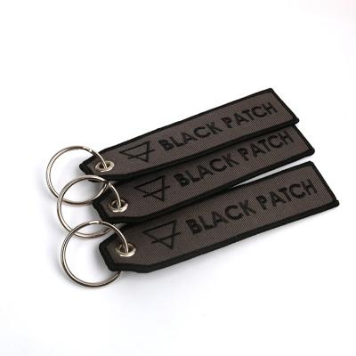 China Fashionable Customized Private Sided Embroidery Souvenir Brand Logo Fabric Tags Air Motorcycle Key Chains For Gifts for sale