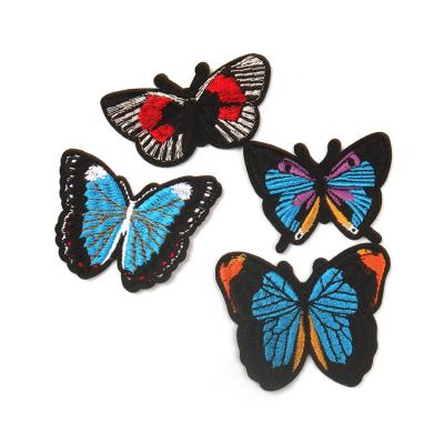 China Sustainable Customized Laser Cut Various Colorful Fabric Labels Butterfly Animal Embroidery Patches For Dresses for sale