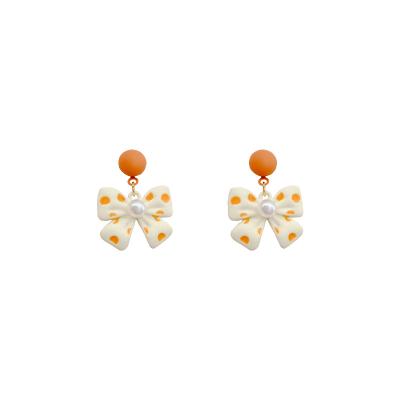 China 2022 Fashion Beautiful Silvery Yellow Bow Earrings S925 Needle Earrings Ethnic Fashion Earrings for sale
