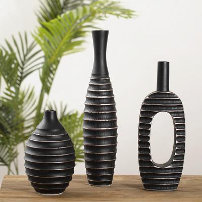 China Factory direct wholesale cheap custom home decoration matte black resin vase elegant for flowers for sale