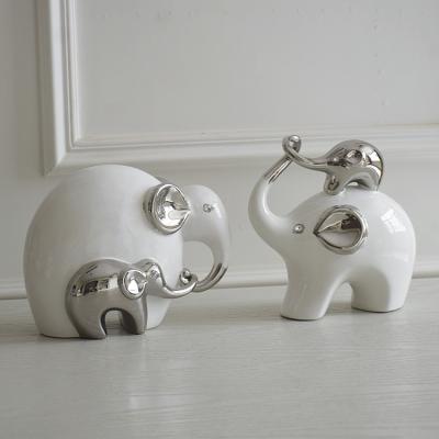 China Beautiful hot sale elegant hotel home decor children table decoration porcelain elephant craft ornaments for sale