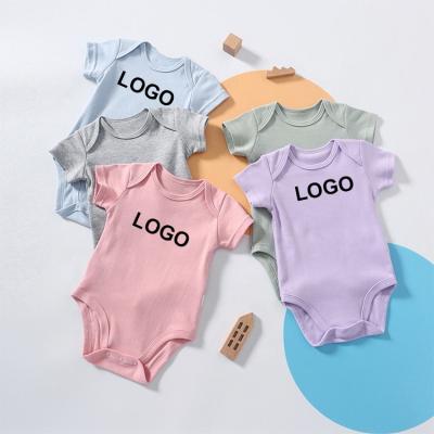 China 100% Newborn Baby Boy Onesie Cotton Baby Clothes Custom Solid Plain Short Sleeve Jumpsuits Empty Newborn Baby Boy Rompers for sale