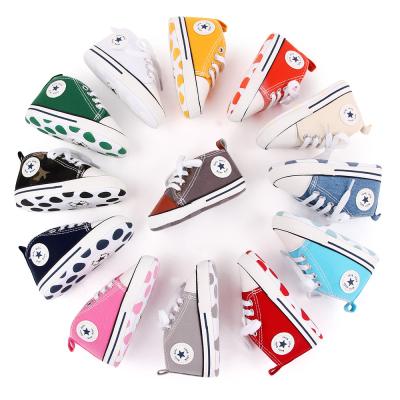 China Designer Wholesale 20 Colors ODM/OEM Breathable Canvas Shoes First Walker Boy and Girl Crib Baby Shoes for sale