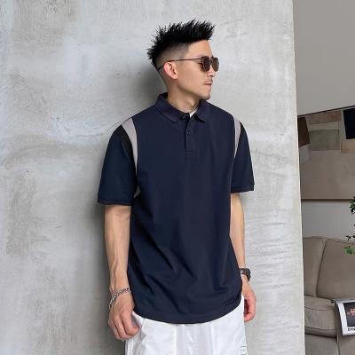 China Versión coreana de la camiseta americana casual floja de la camiseta de la manga del cortocircuito del color del encanto del polo de la solapa de los hombres del verano de la marea en venta