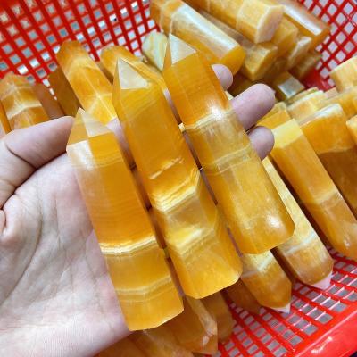 China China Natural Orange Calcite Tower With White Stripes Crystal Crafts for sale