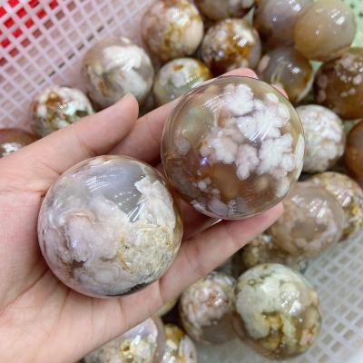 China Travel Agency Wholesale Natural Healing Crystal Flower Agate Spheres Stone have stripe for gift or decoration for sale