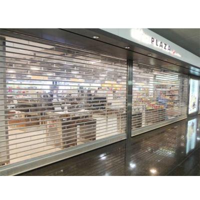 China Anti Theft Shop Sliding Clear Polycarbonate Glass Door Polycarbonate Rolling Door for sale