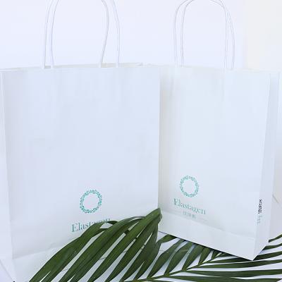 China Recycled Materials Logo Printed Luxury White Kraft Custom Paper Bag With Handles Packing Bags for sale