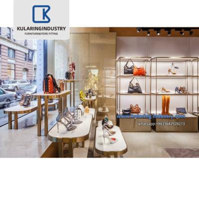 China Customized high-end design brand shoe store interior design metal display racks racks mall boutique shoes retail store fittings furniture for sale