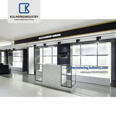 China Modern Modern Shop Counter Design Men Clothes Shop Display Rack Retail Boutique Men Garment Store Showcase Design Counter for sale