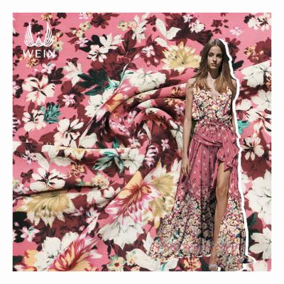 China New Arrival WI-D03 anti-static medium weight pink background bright color flower printed polyester woven fabric for ladies dress for sale