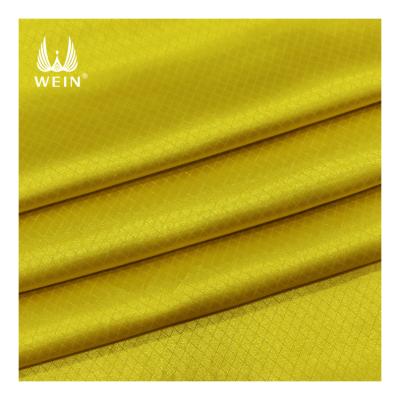 China Stretch ready to ship and comfortable soft jacquard silk satin checked stretch fabric for pajamas for sale