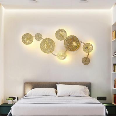 China New Chinese style hotel bedroom modern creative background wall lotus gold copper leaf led wall lamp for sale