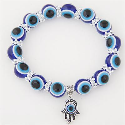 China Hiphop Hand Chain With Blue Eyes Evil Eye Hand Ornaments Retro Beaded Resin Hand Eyes Hans Fashion for sale