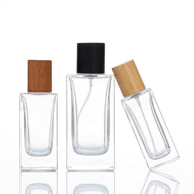 China 30ml 50ml 100ml Cosmetic High Definition Stain Cap Spray Pump Combination Series Wooden Perfume Comes In Glass Bottles for sale