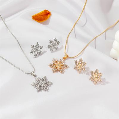 China Free Sample Trendy Women's Fashion Temperament Christmas Ornament Full Diamond Snowflake Necklace Earring Pendant Set for sale