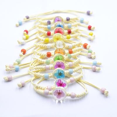 China 12 Colors Factory Dried Flower Girl Glass Crystal Jewelry Handwoven Ethnic Bracelet Ladies for sale