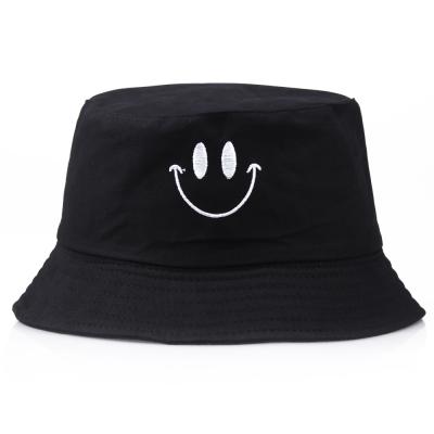 China Outdoor Casual Picture Visor Sun Basin Hats Embroidered Black And White Cute Smiling Face Bucket Hat for sale