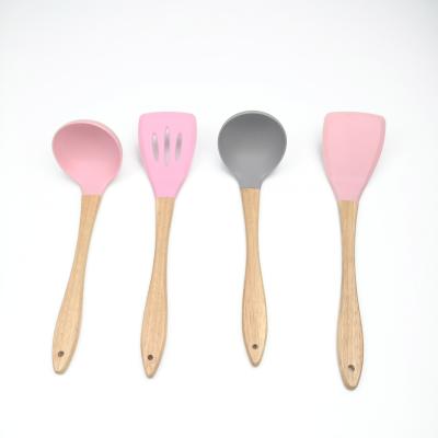 China Viable Wholesale Customized Bamboo Color Handle Silicone Cookware Set for sale