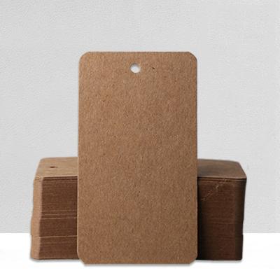 China Custom Apparel Printed Other Brand Logo Hanging Tags Recycled Kraft Paper Shirt Hanger Tag for sale