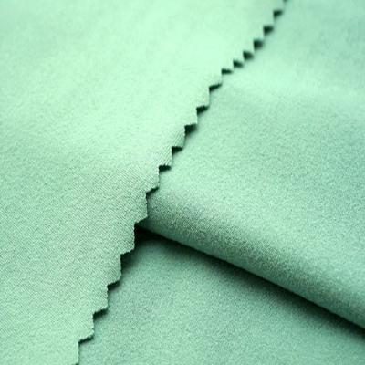 China Anti-Static brushed jersey stretch knit milk silk dyed eco-friendly dty fabric for woman dress for sale