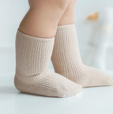 China New Autumn Breathable Spring Cotton Baby Solid Color Kids Loose Socks Combed Newborn Tube Sock for sale