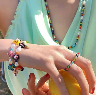 China BOHEMIA Jingle YI Explosive Korean CIS Stacking Color Texture Bead Bracelet Temperament Hand Painted Acrylic Glass Beaded Woman for sale