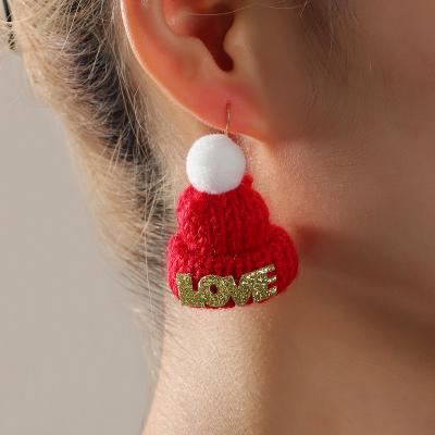 China 2021 Christmas Cute Soft Cute Dangle Wool Letter YI Christmas Hat Earrings Girl Christmas Party Holiday Jewelry Cute Earrings for sale