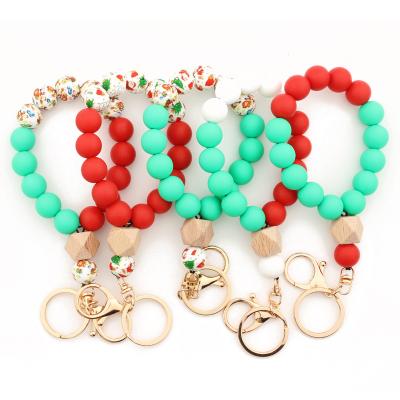 China Christmas Style Jingle YI Car Key Ring Bracelet Silicone Beaded Keychain Christmas Gift For Women for sale