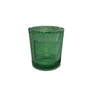 China Home Decoration OEM Old Fashioned Empty Crystal Tea Light Votive Embossed Green Glass Candle Holder Beautiful for sale