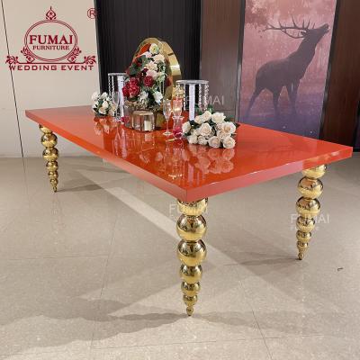 China Modern New Design MDF Top Ball Leg Gold Stainless Steel Red Wedding Event Table for sale