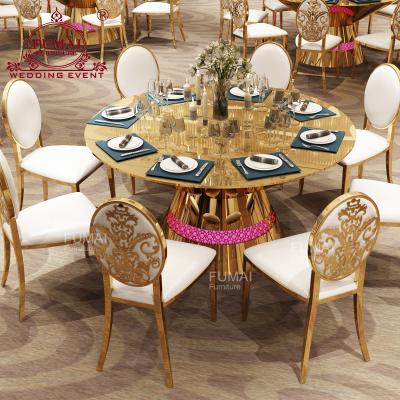 China Various Colors 10 People Contemporary Stainless Steel Round Mirror Glass Table With Chairs for sale