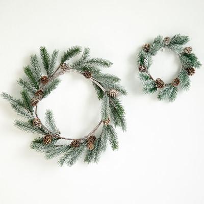 China Carry Kaile Christmas Snowy PE Artificial Pine Wreath Christmas Branches Braid Christmas Door Wreath for sale