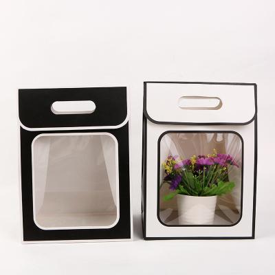 China Recyclable made in China PVC windowed kraft paper trapese for flowers paper bags for gift with handle bag for sale