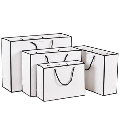 China Recyclable High Quality Ready To Ship Customizable Logo Designed Paper Gifts Bag With Ribbon Handle for sale