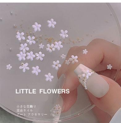 China Five-petal flower white manicure small white flower manicure decoration steel ball manicure three-dimensional resin flower glass mixed for sale