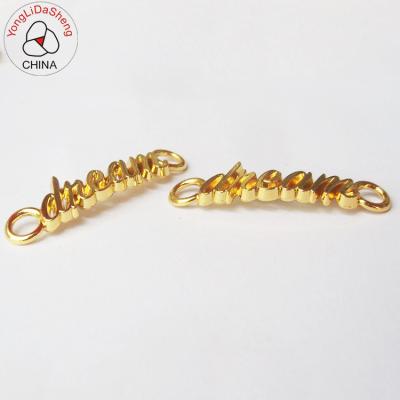 China Sustainable OEM Customized Brand Letters Gold Metal Label For Clothes for sale