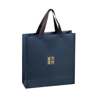 China Custom High Quality Gift Bag With Customized Design Paper Tote Luxury Handbag With Ribbon For Clothing And Skin Care Products for sale