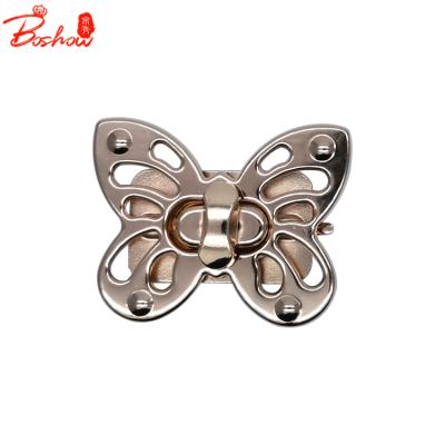 China Fasion 2021 Various Decorative Butterfly Shaped Lock Quality Twist Turn Lock Gold Black Gold Sliver Iron Push Lock For Handbags Accessories for sale