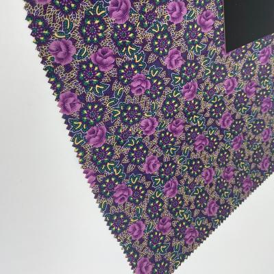 China Memory fashion high quality purple flower PVC coating fabric with WR for raincoat/raincoat/poncho clothing fabric for sale