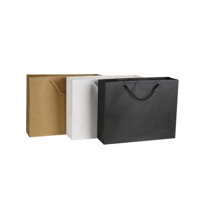 China Recyclable Wholesale Custom Logo Printed Black Luxury Shopping Gift Apparel Paper Bag With Handle for sale