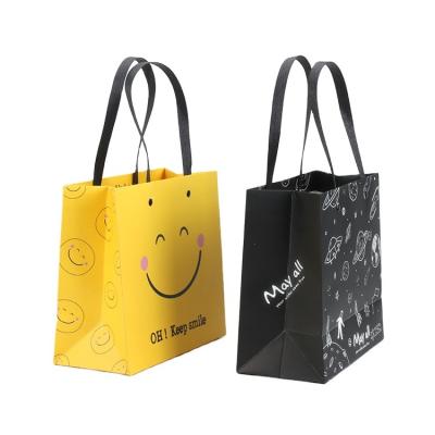 China OEM Customized Recyclable Luxury Eco - Friendly Paper Tote Bag Logo Printed Clothing Shopping Gift for sale