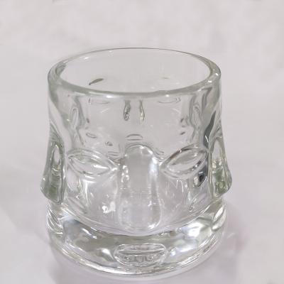 China Hotel home decoration candle holder human face transparent glass shape pressed candle glass jar for sale