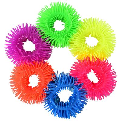 China Funny colorful TPR stretch flower wrist band softkids toy stripper for sale