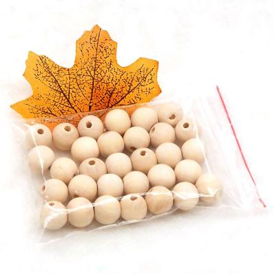 China Eco-Friendly In Stock Round 16mm Maple Wooden Accessories Chew DIY Bead Baby Teething Toys Wooden Beads for sale