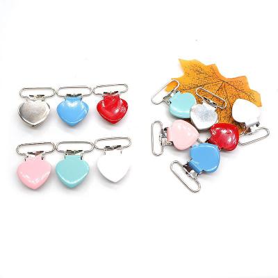 China New Product BPA Launch Style Heart Free Single Shape Metal Baby Pacifier Clips for sale